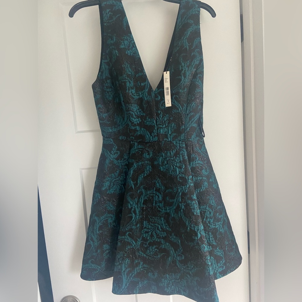 Alice and Olivia cocktail dress. V neck, flared bodice